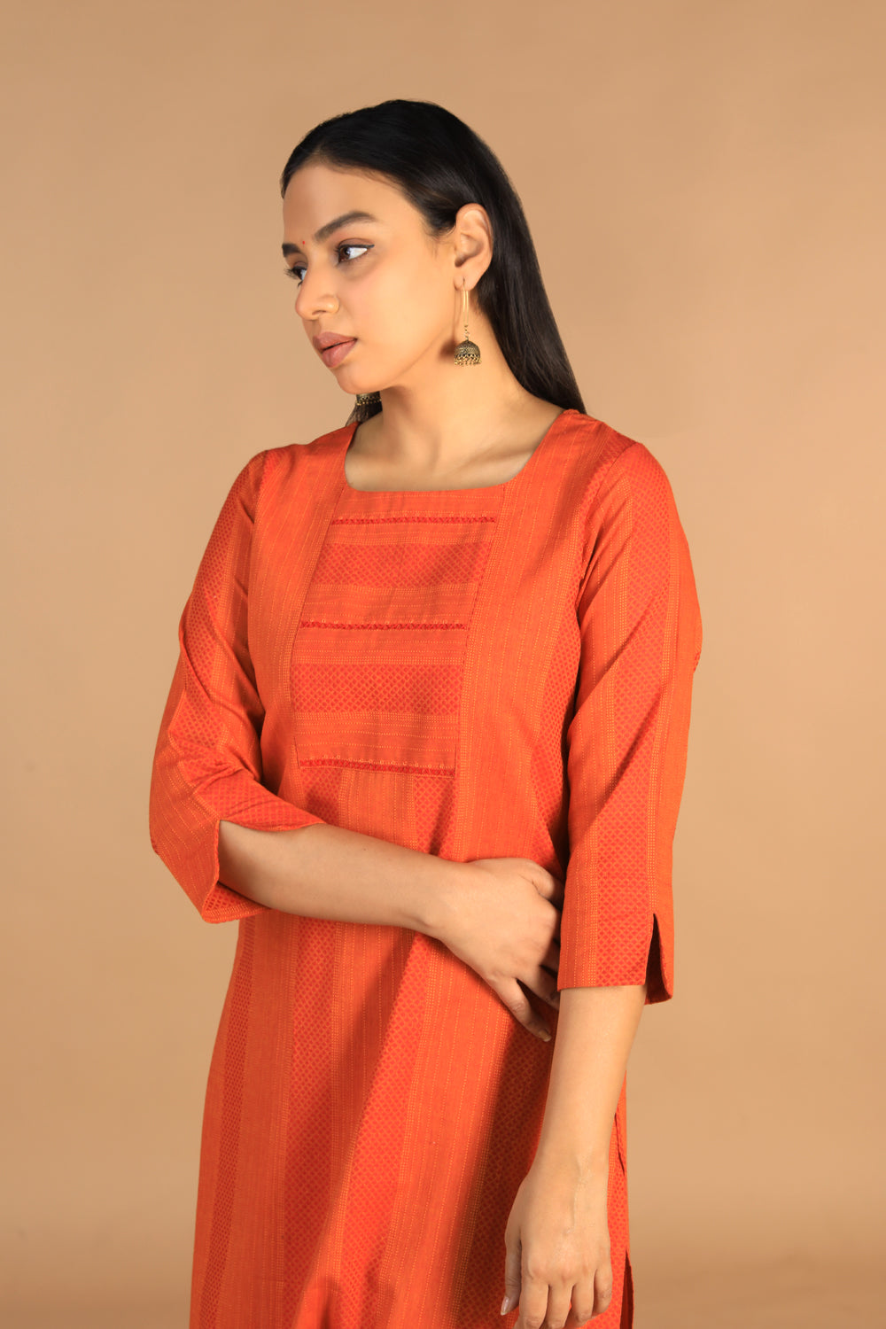 Collection of Marigold orange woven cotton kurti in a gallery layout