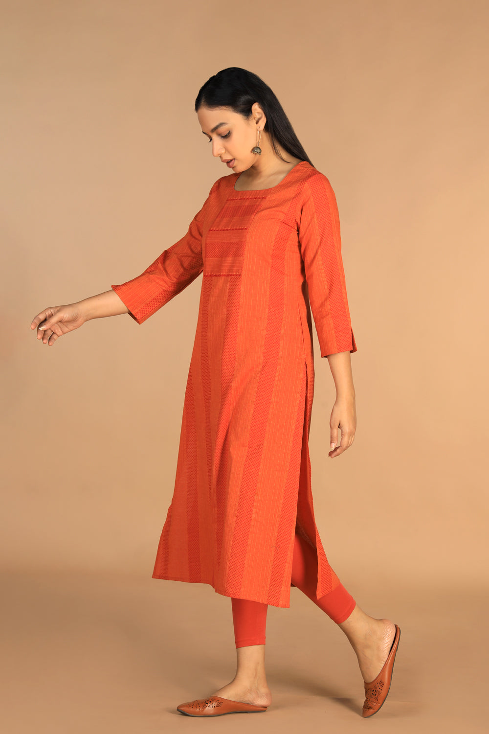 Collection of Marigold orange woven cotton kurti in a gallery layout