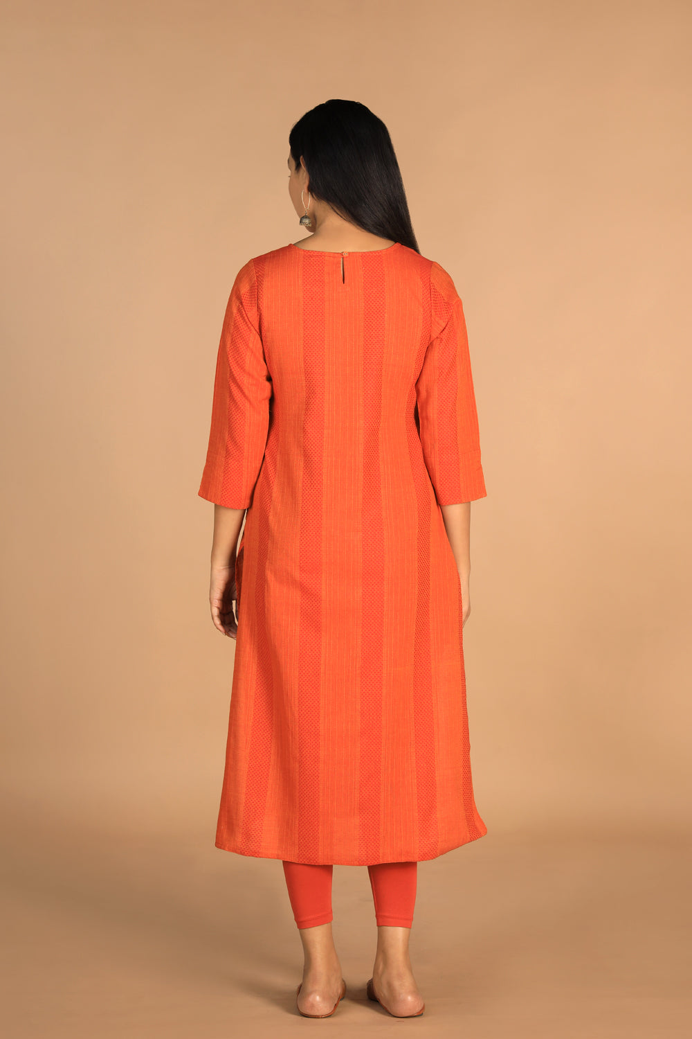 Collection of Marigold orange woven cotton kurti in a gallery layout