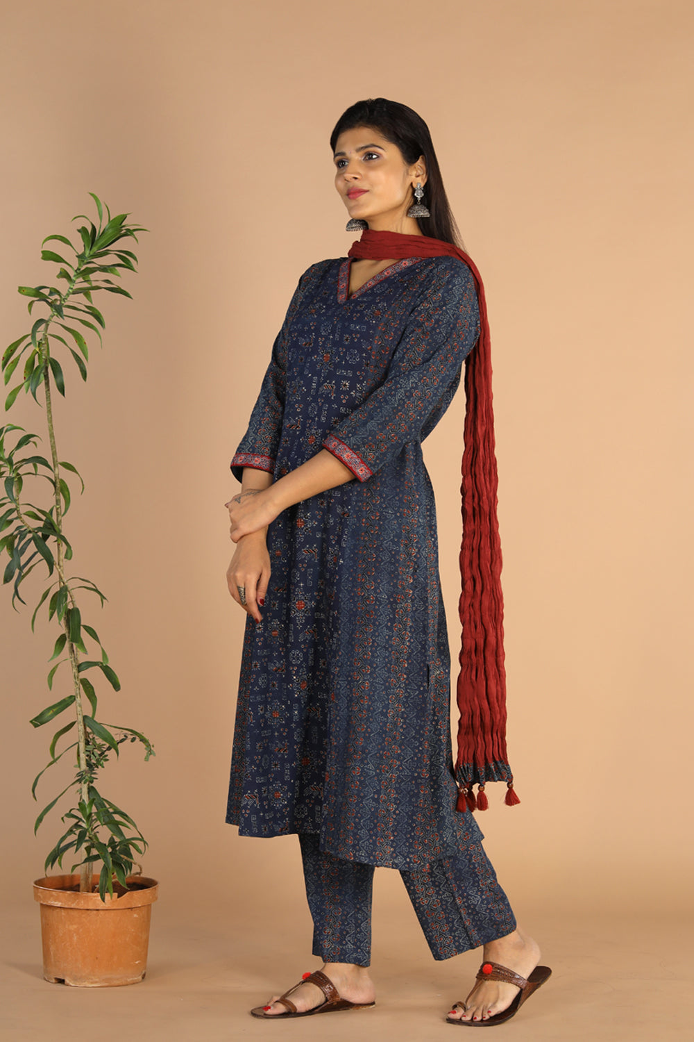 Collection of Indigo Ajrak handblock printed cotton kurta , pants and dupatta set in a gallery layout