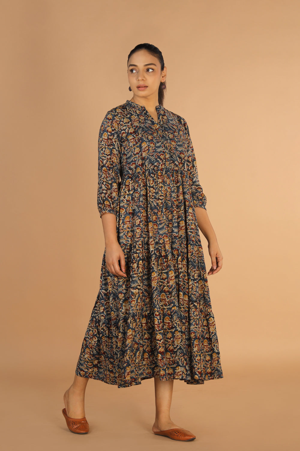 Collection of Kalamkari block printed tiered dress in a gallery layout