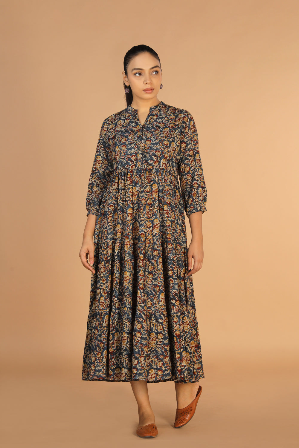 Collection of Kalamkari block printed tiered dress in a gallery layout