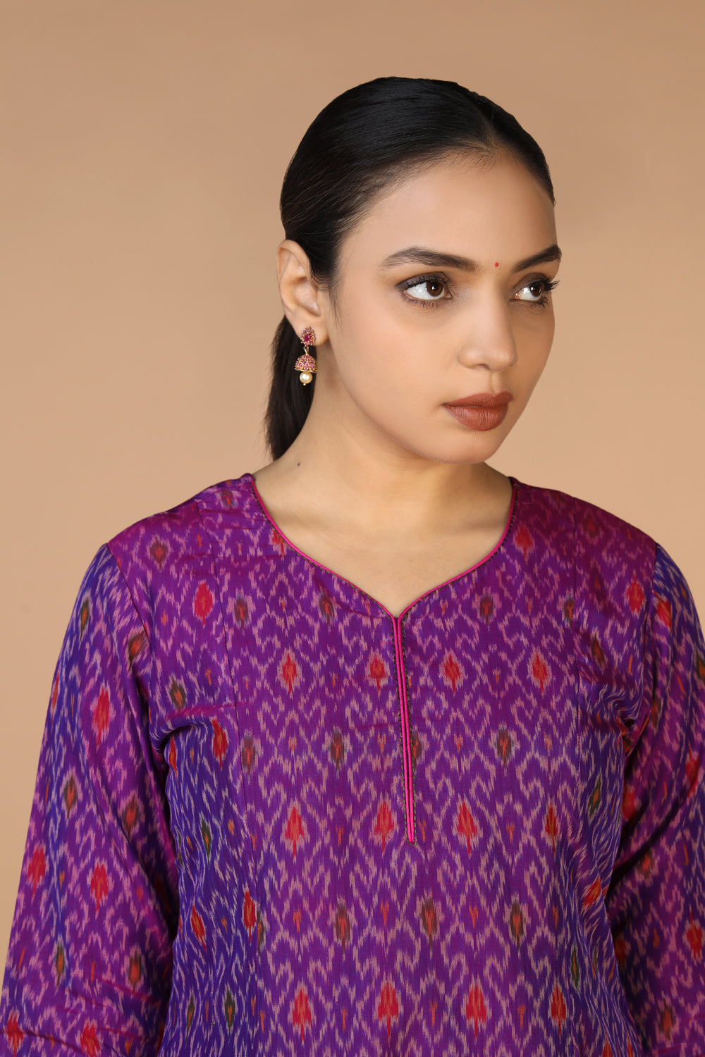 Collection of Purple Silk Pochampally Ikat kurti in a gallery layout