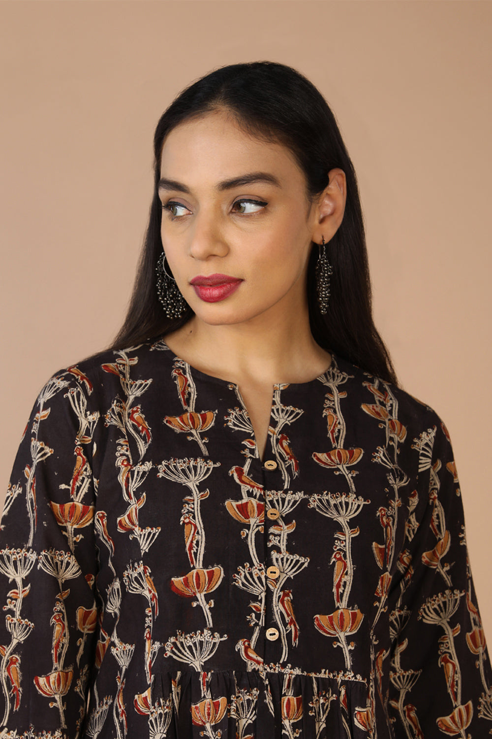 Collection of Charcoal black cotton Kalamkari kurti in a gallery layout