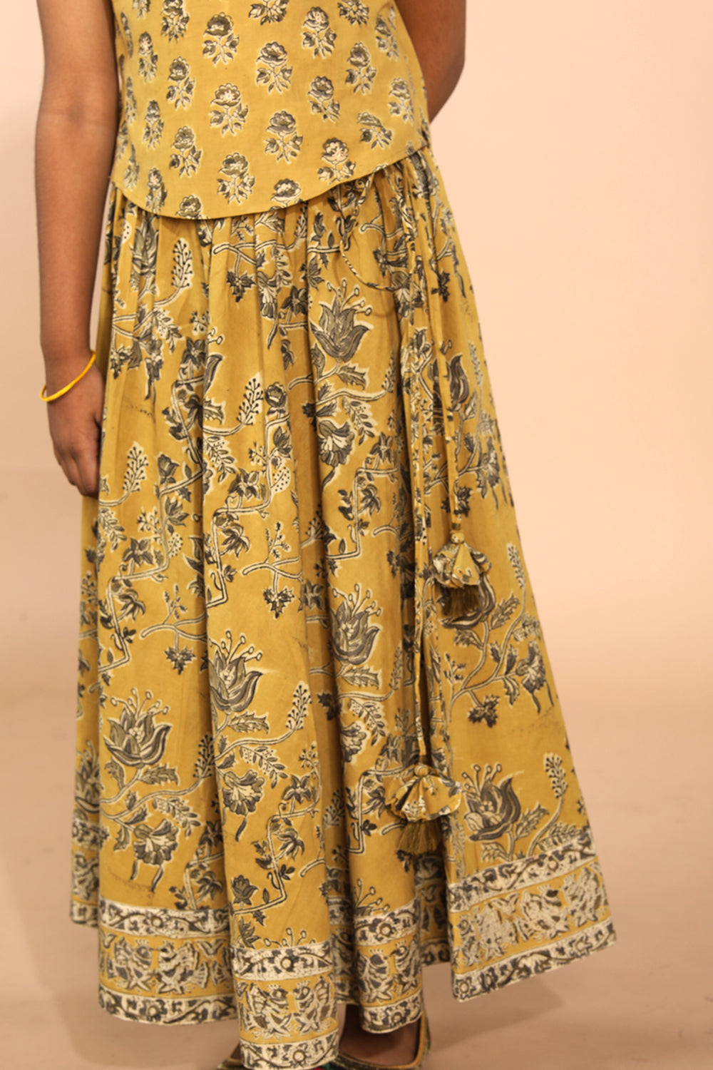 Collection of Cotton Kalamkari girls skirt & top set in a gallery layout