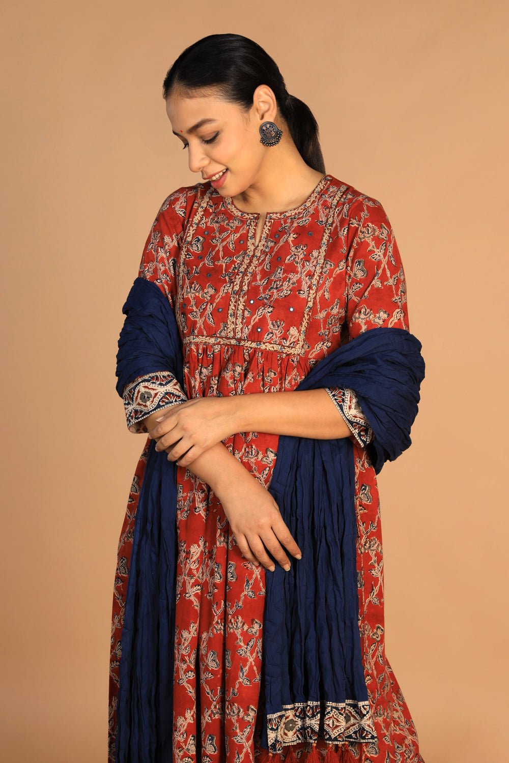 Collection of Maroon and indigo cotton Kalamkari set in a gallery layout