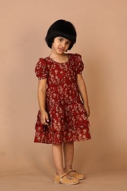 Collection of Maroon kalamkari hand block printed girls frock. in a gallery layout