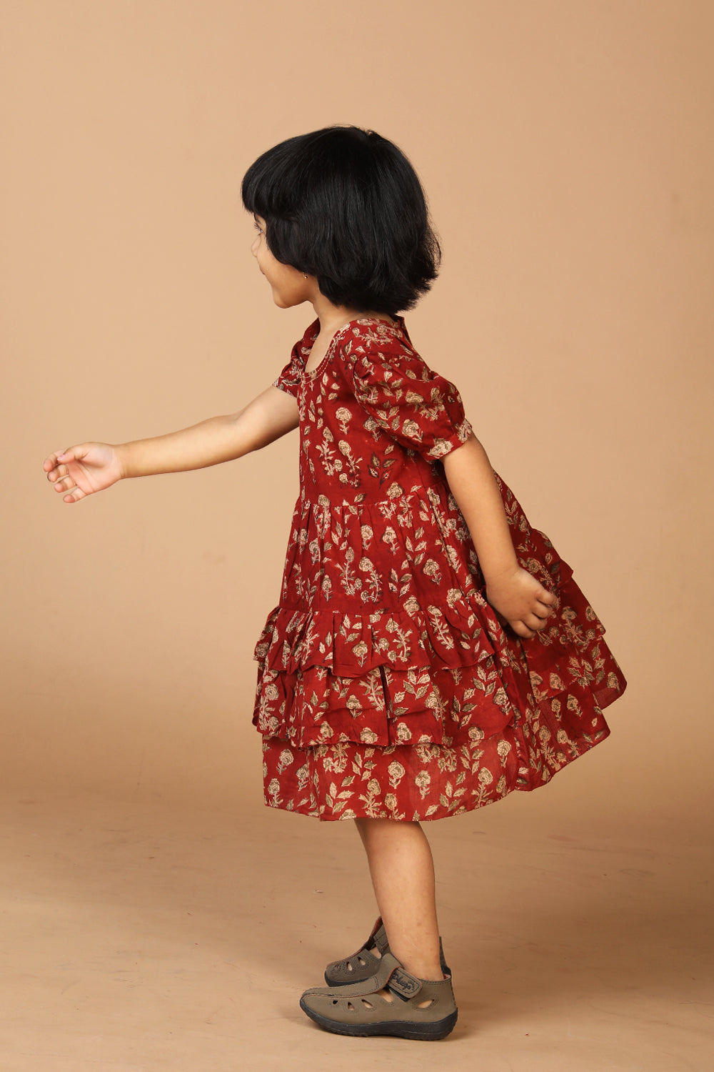 Collection of Maroon kalamkari hand block printed girls frock. in a gallery layout