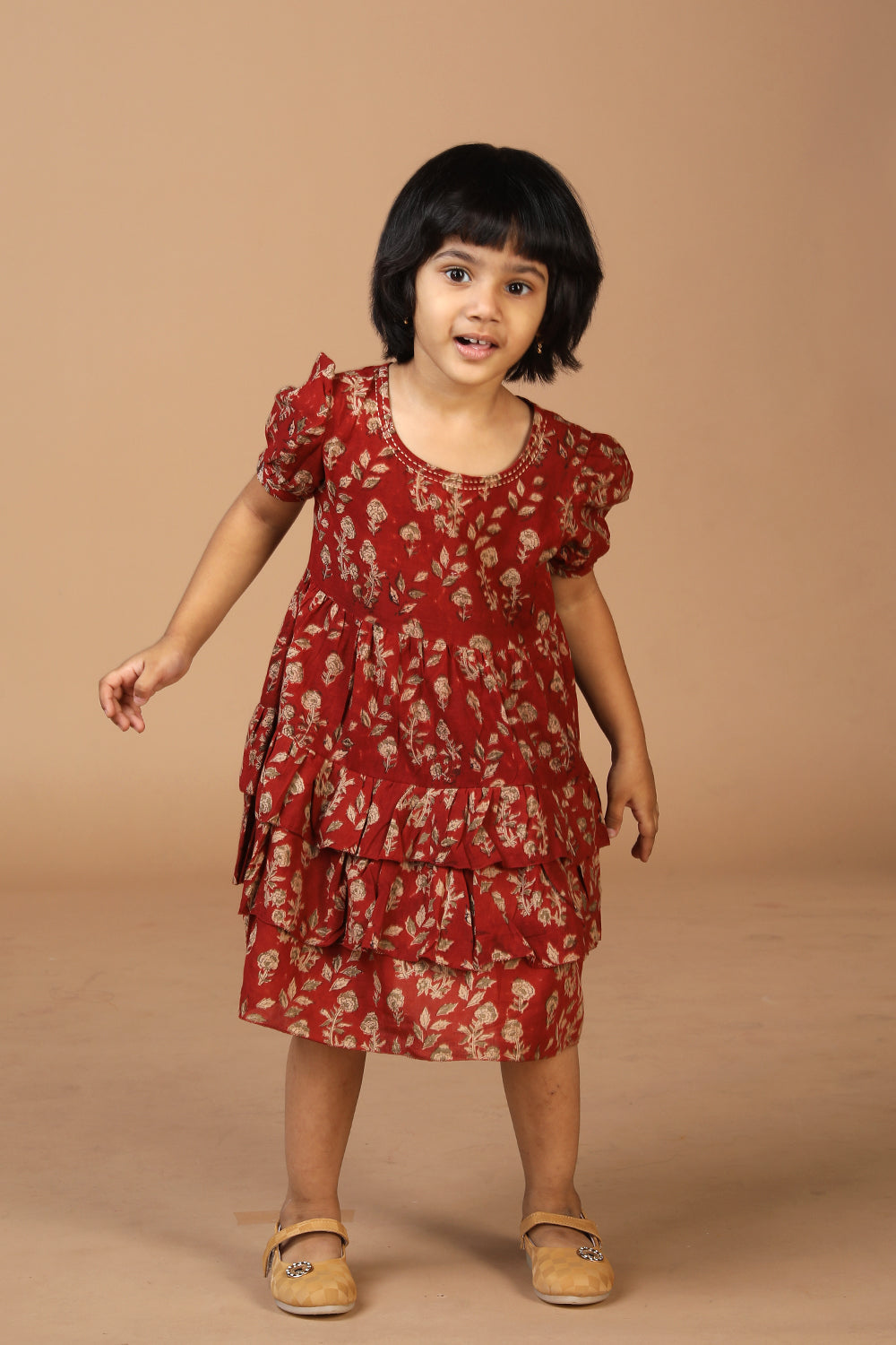 Collection of Maroon kalamkari hand block printed girls frock. in a gallery layout