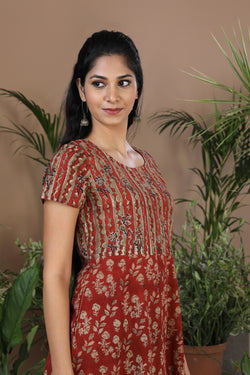 Collection of Maroon floral Kalamkari handblockprinted kurti in a gallery layout