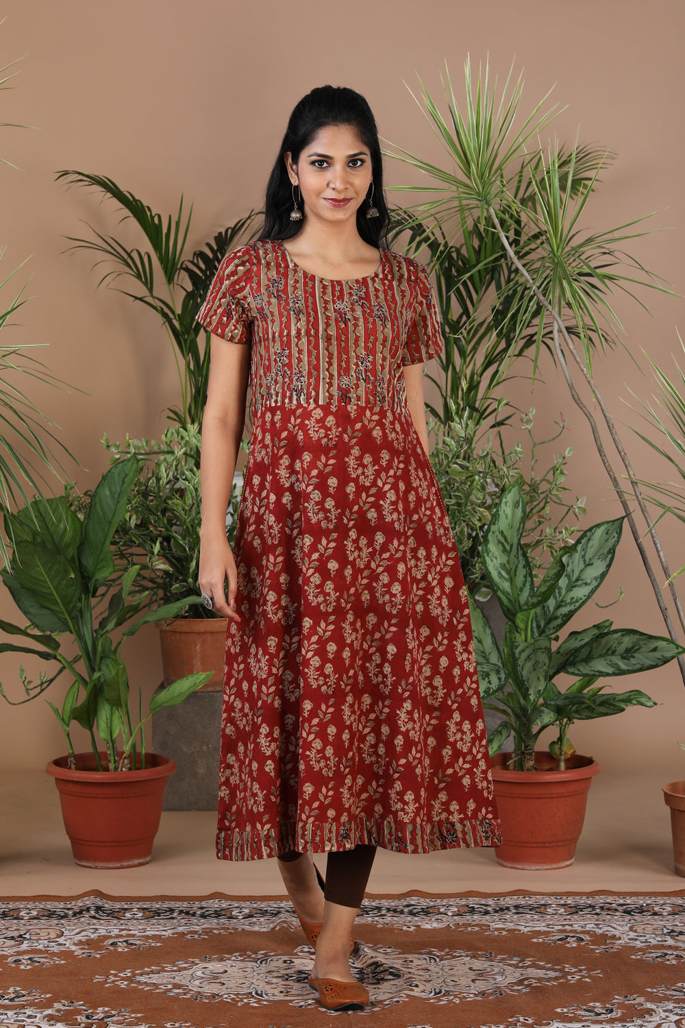 Collection of Maroon floral Kalamkari handblockprinted kurti in a gallery layout