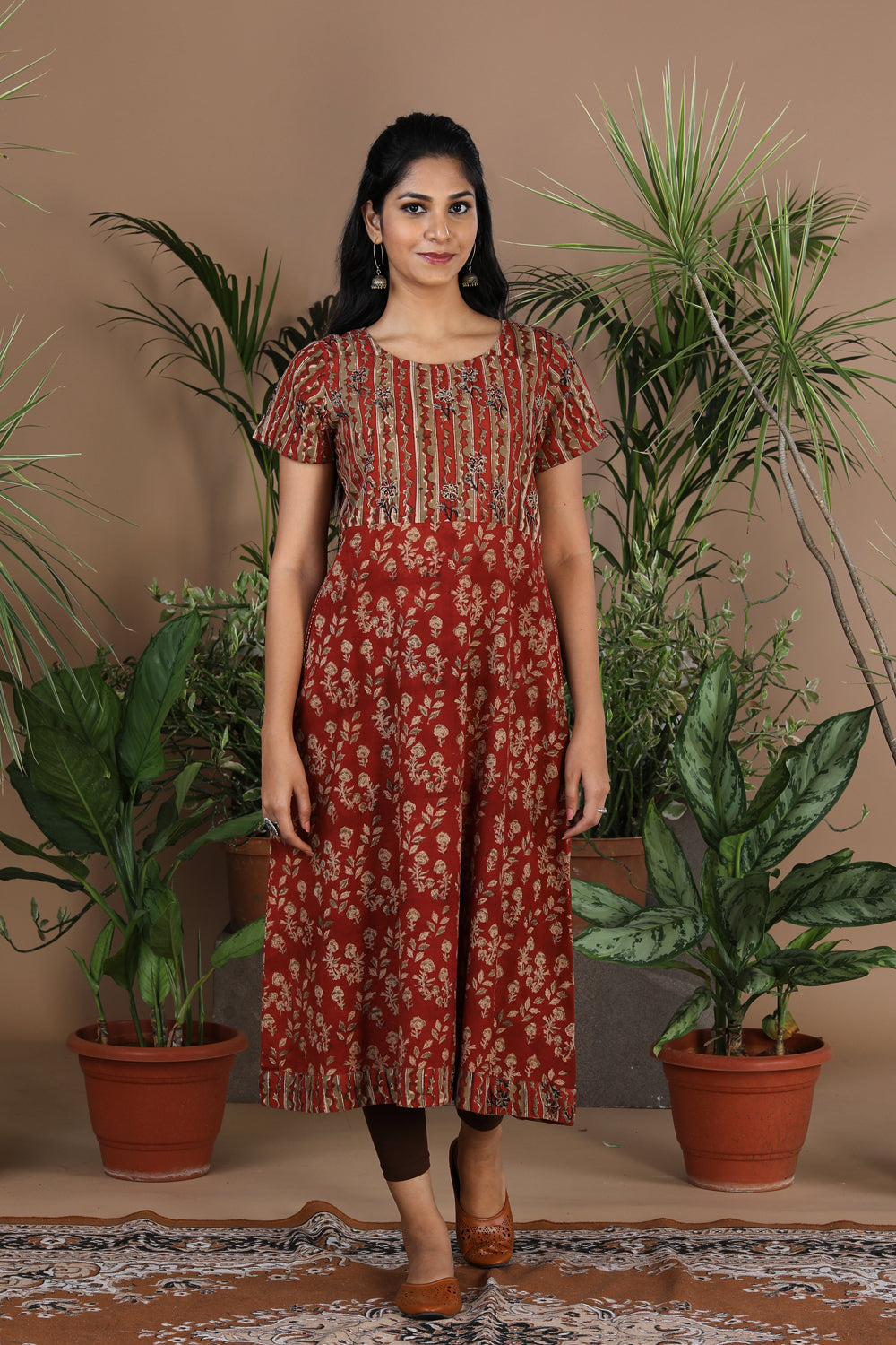 Collection of Maroon floral Kalamkari handblockprinted kurti in a gallery layout