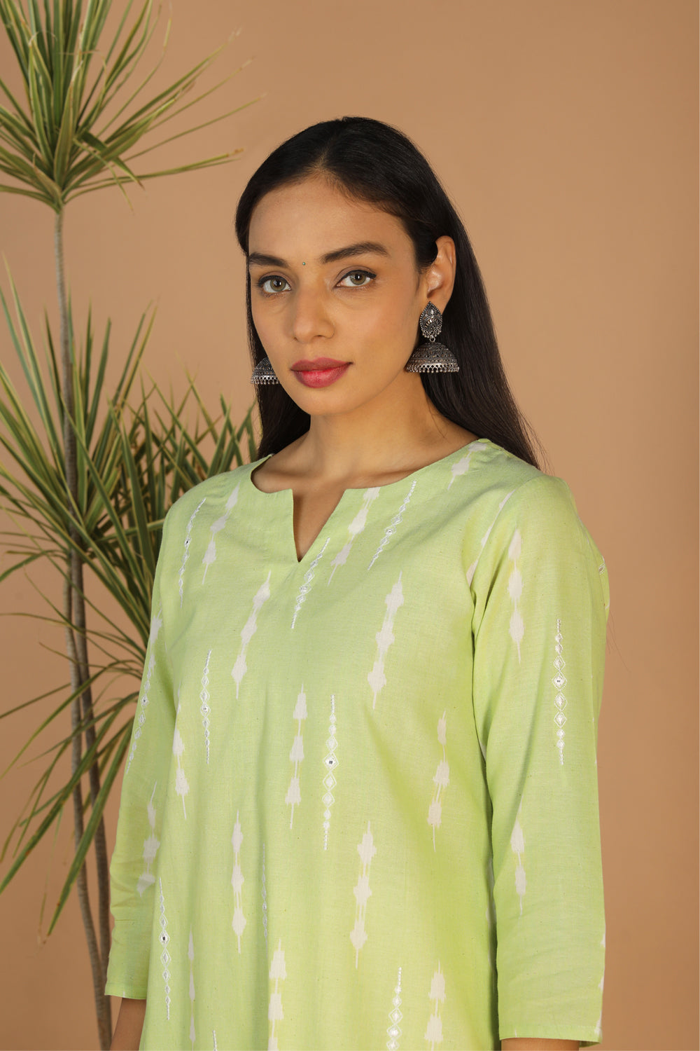 Collection of Tea green embriodered Pochampally Ikat kurta in a gallery layout