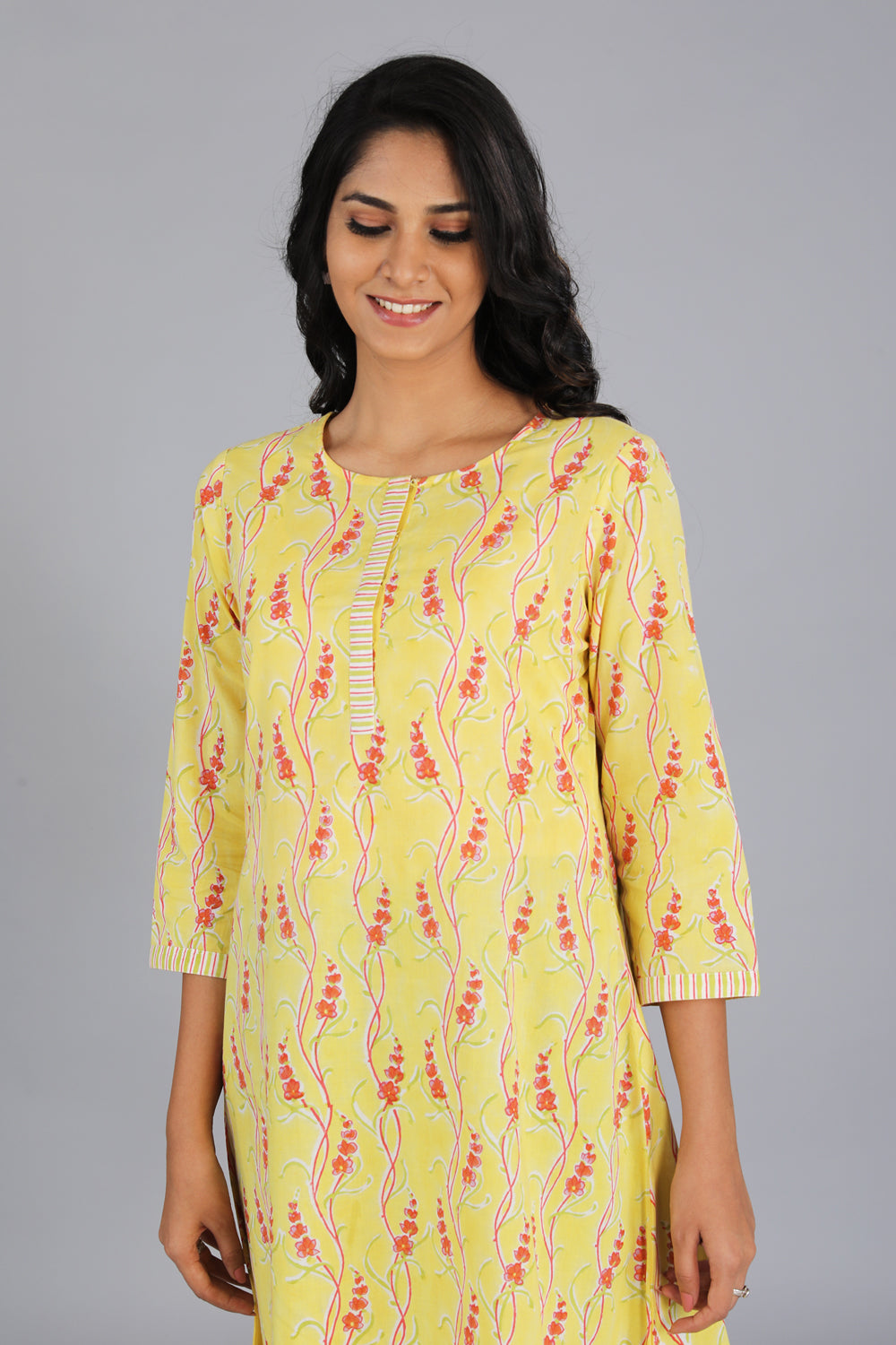 Collection of Handblock printed yellow kurti in a gallery layout