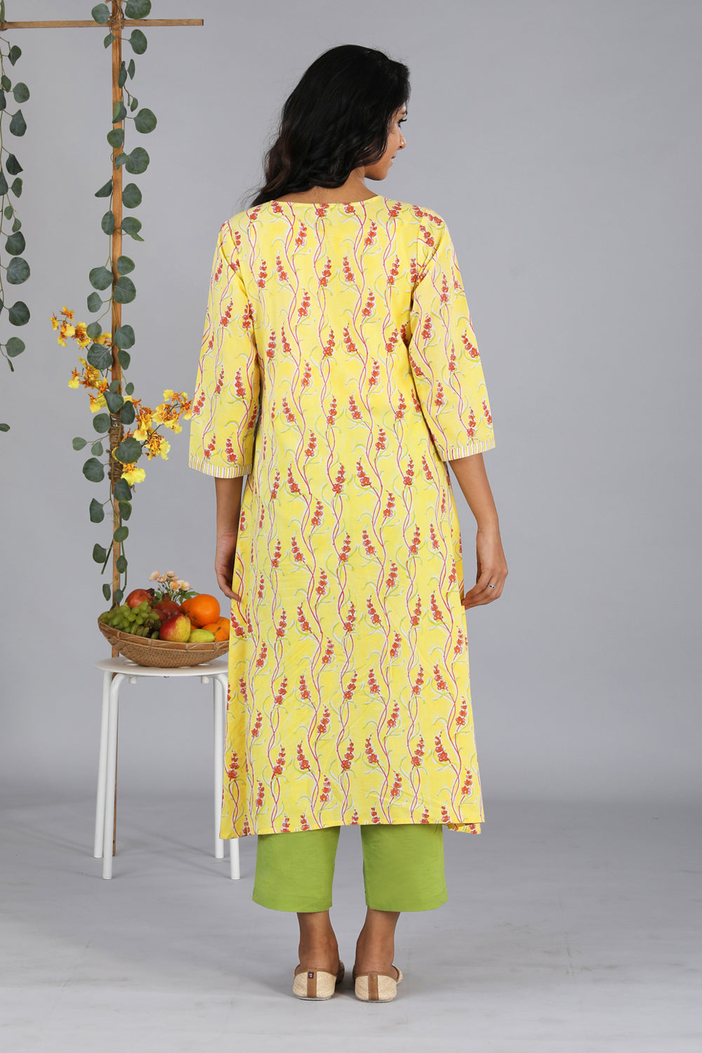 Collection of Handblock printed yellow kurti in a gallery layout