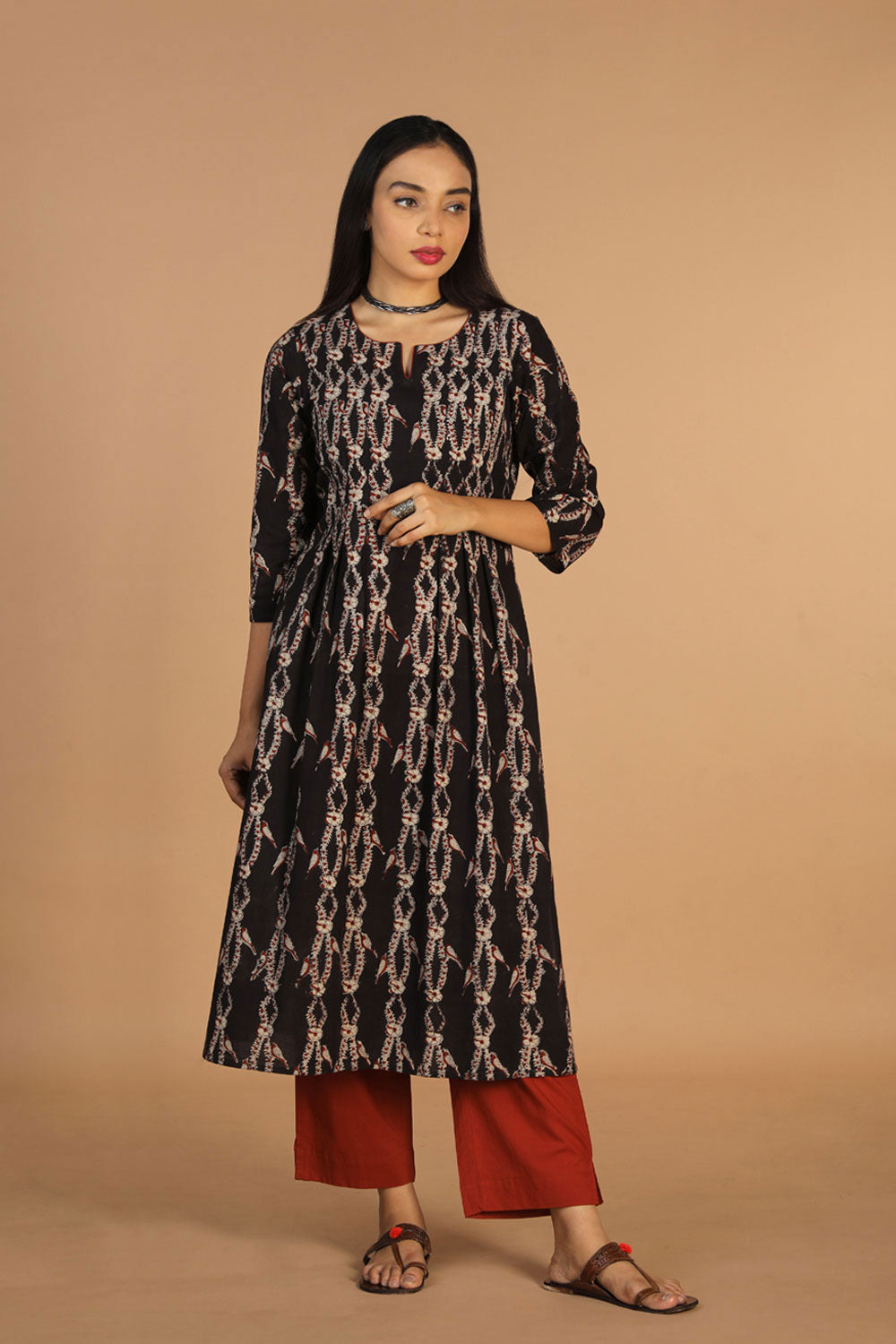 Collection of Cotton kalamkari pleated kurta with slit and piping in a gallery layout