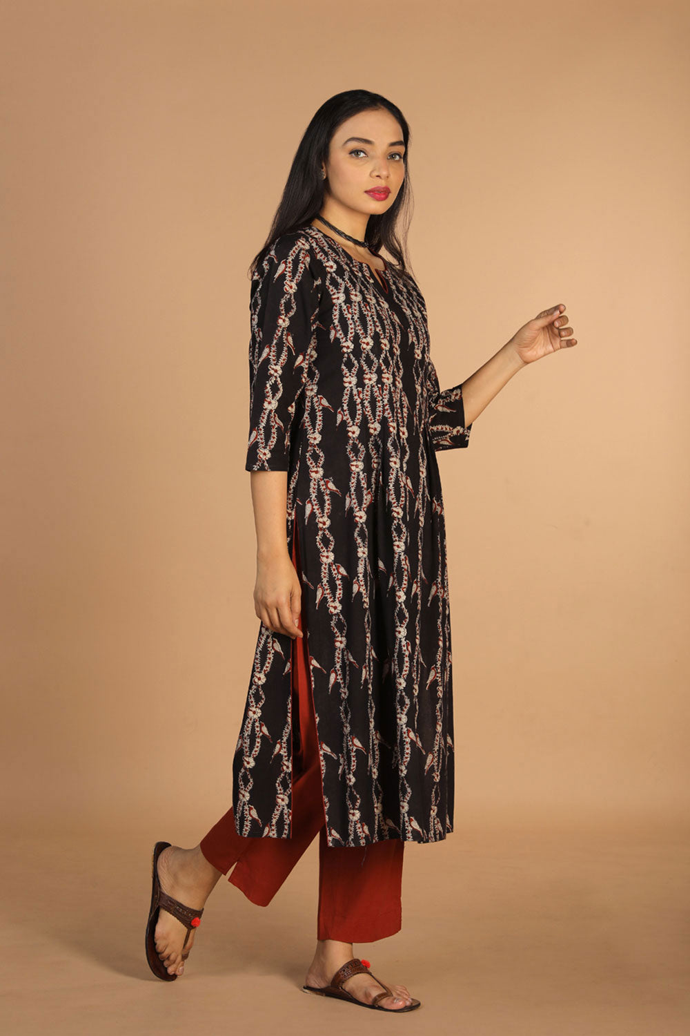 Collection of Cotton kalamkari pleated kurta with slit and piping in a gallery layout