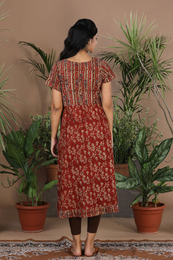 Collection of Maroon floral Kalamkari handblockprinted kurti in a gallery layout