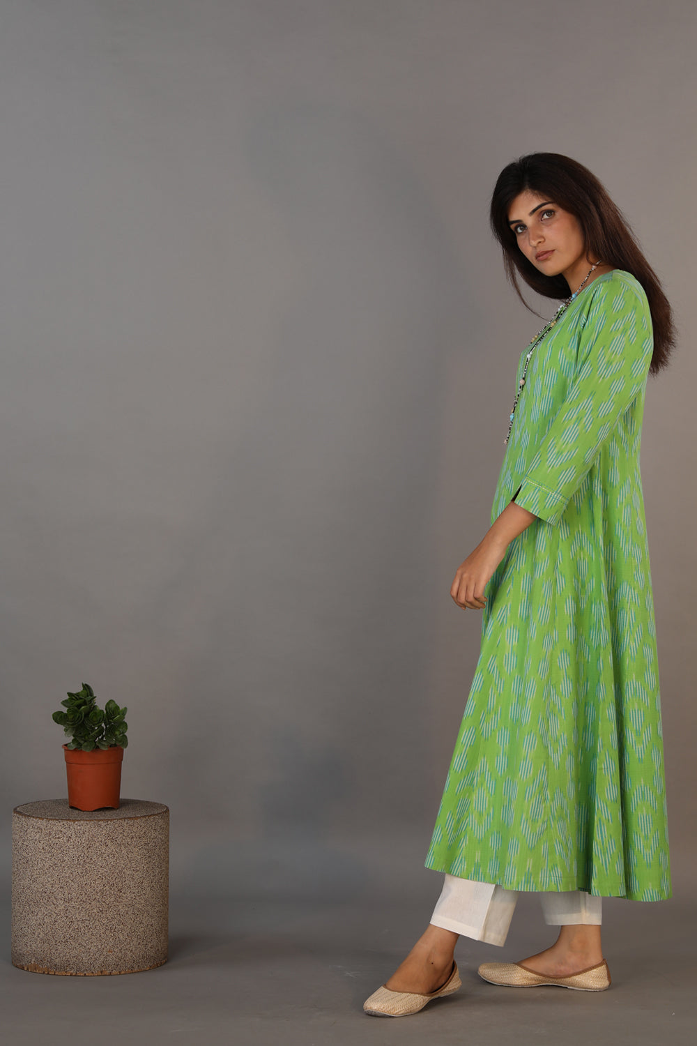 Collection of Basil green hand woven cotton Ikat dress in a gallery layout