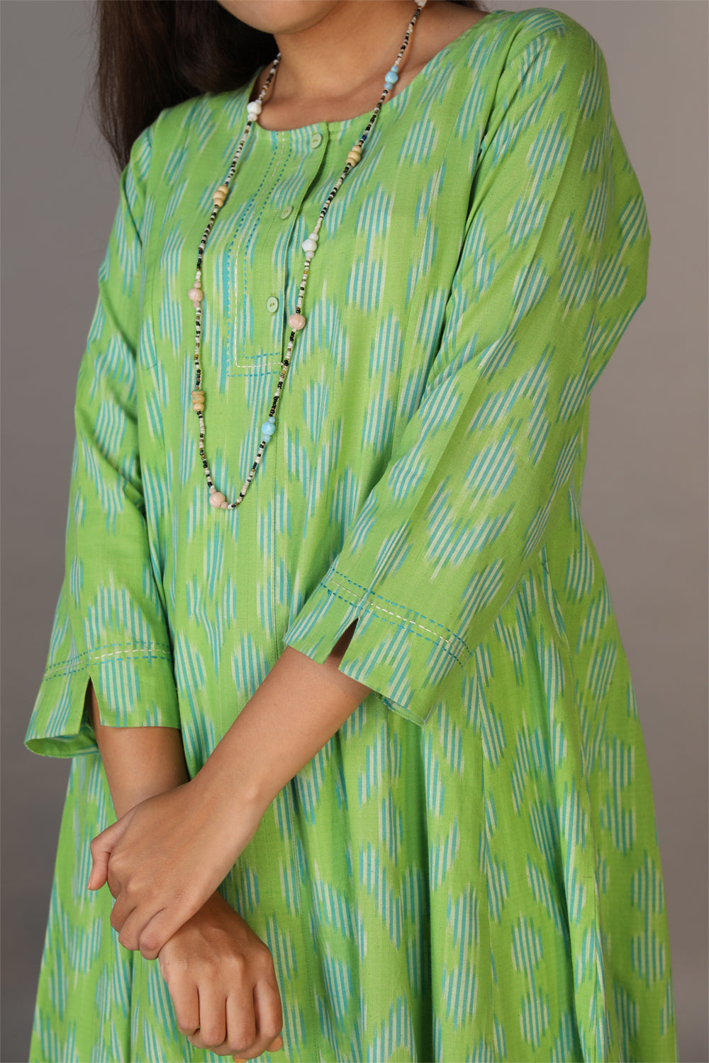 Collection of Basil green hand woven cotton Ikat dress in a gallery layout