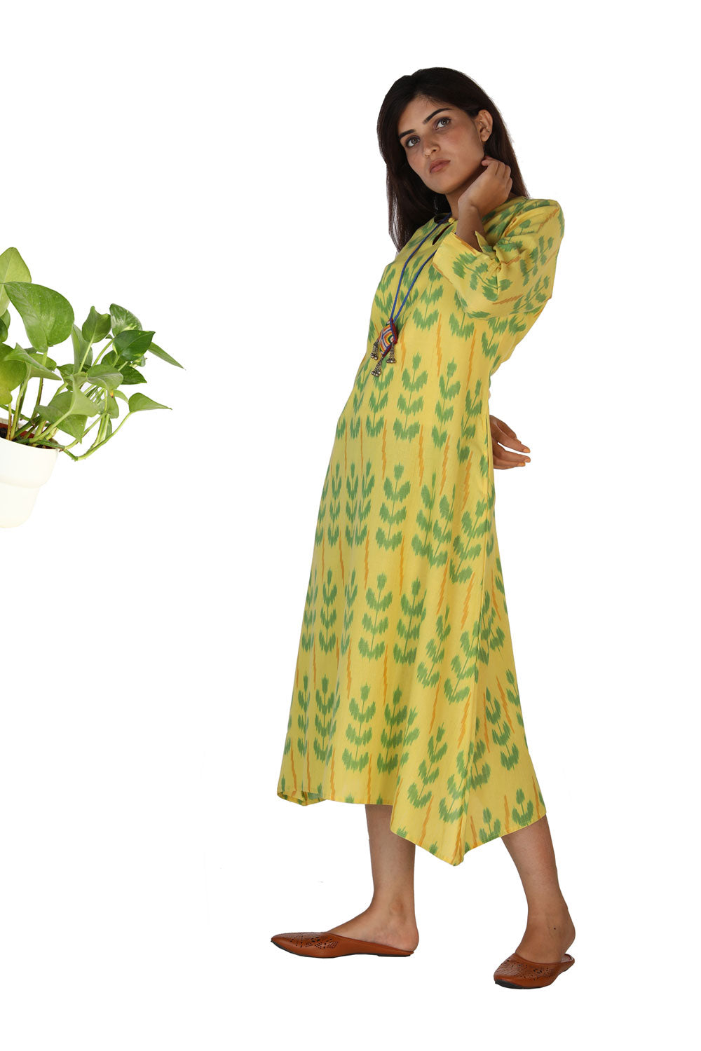 Collection of Lemon yellow flared Ikat Pochampally kurti. in a gallery layout